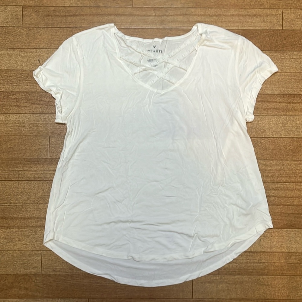 American eagles new never worn white soft and sexy with Lacey straps on V neck